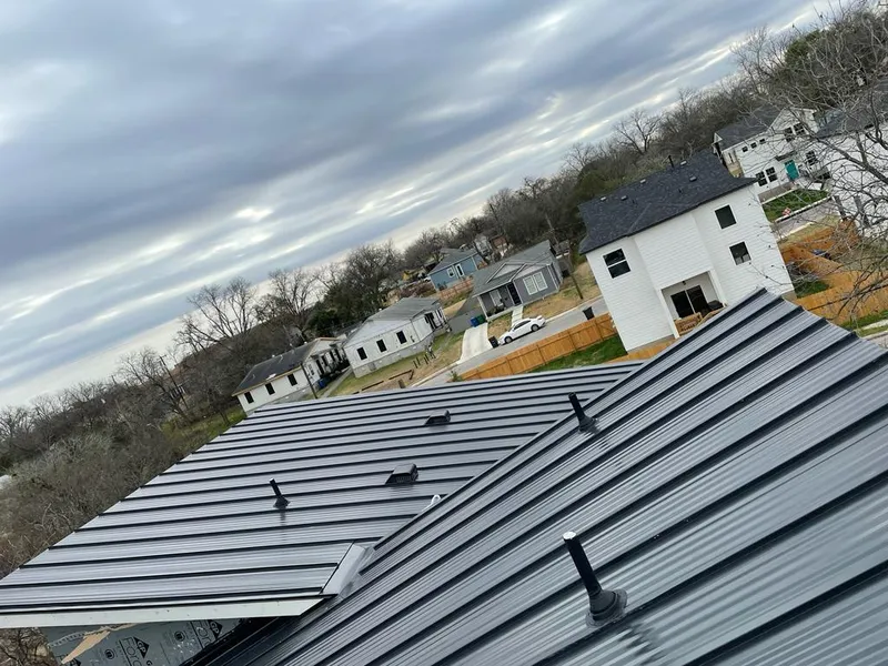 Standing seam metal roof panels with vents for Skylight Repair in Lewisville